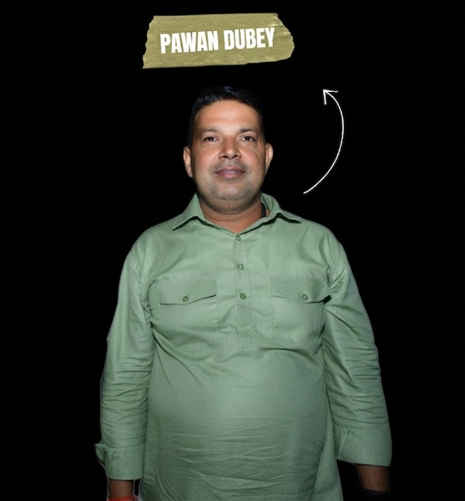 An enhanced portrait of Pawan Dubey in a light green traditional outfit against a black background, with a "Pawan Dubey" name tag above, associated with rajdairy farm.